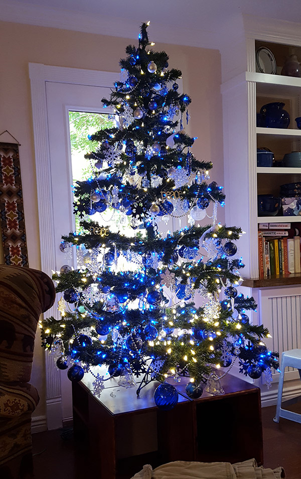 A Christmas tree with cobalt blue lights