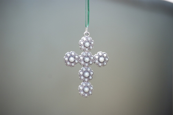 Cross carved in floral designs and pearls for decorations