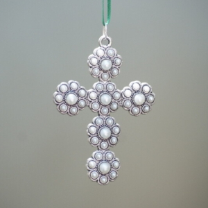 Cross carved in floral designs and pearls for decorations