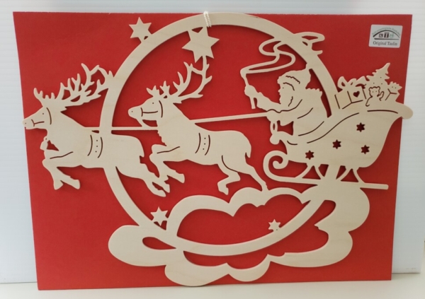 Wooden carved santa riding rein deer with gifts