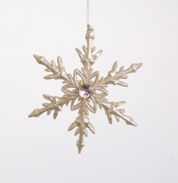 Glittery gold colored snow flake for decoration