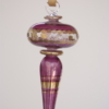 Teardrop shape rotated Egyptian glass hanging in purple