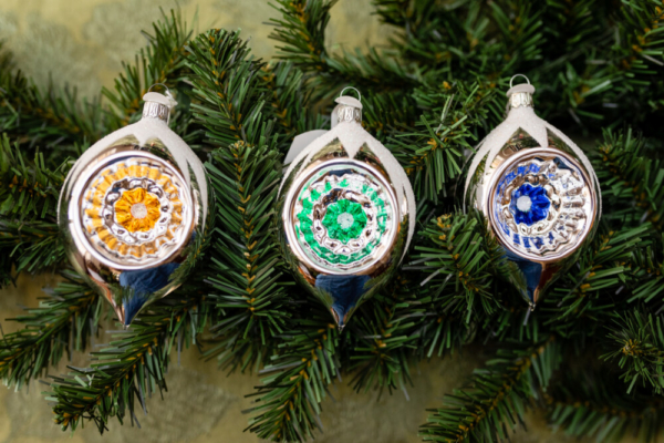 Three Gold Color Balls Hanging on the christmas Tree