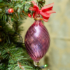 Swirl Wiggle pink oval ornament hanging on the tree