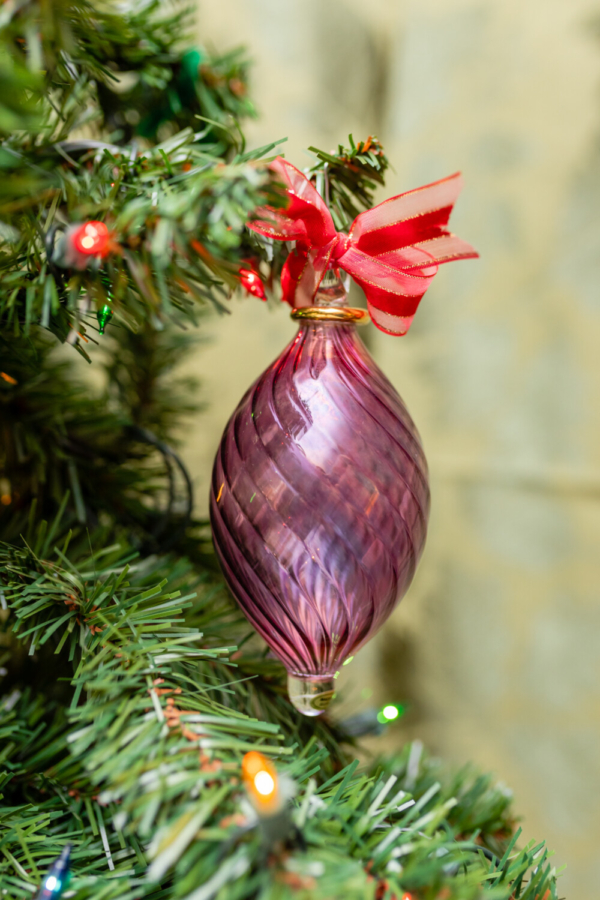 Swirl Wiggle pink oval ornament hanging on the tree