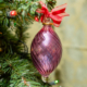 Swirl Wiggle pink oval ornament hanging on the tree