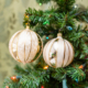 Two copper color balls hanging on the tree