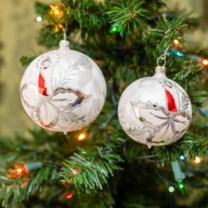 silver color glass balls hanging on the Christmas tree