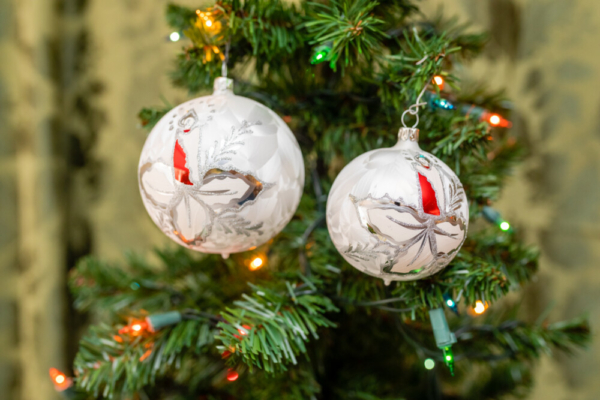 silver color glass balls hanging on the Christmas tree