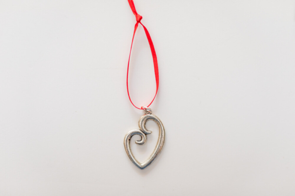 Heart-shaped aluminum pendant with red tag