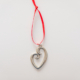 Heart-shaped aluminum pendant with red tag