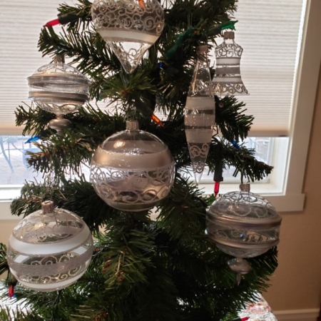 Hand Painted Crystal Balls and Bells hanging on the tree