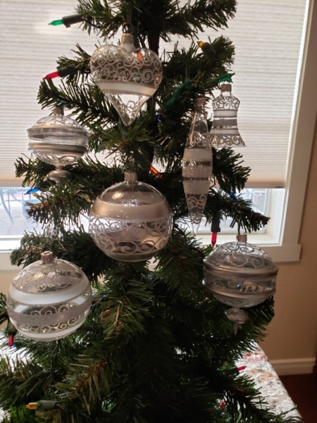 Hand Painted Crystal Balls and Bells hanging on the tree