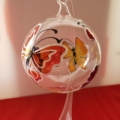 Hand-painted red and orange butterfly on crystal ball