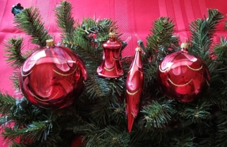 Red color Ball Swirls hanging on the christmas tree