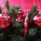 Red color Ball Swirls hanging on the christmas tree