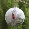 A close-up shot of hand-painted silver crystal ball