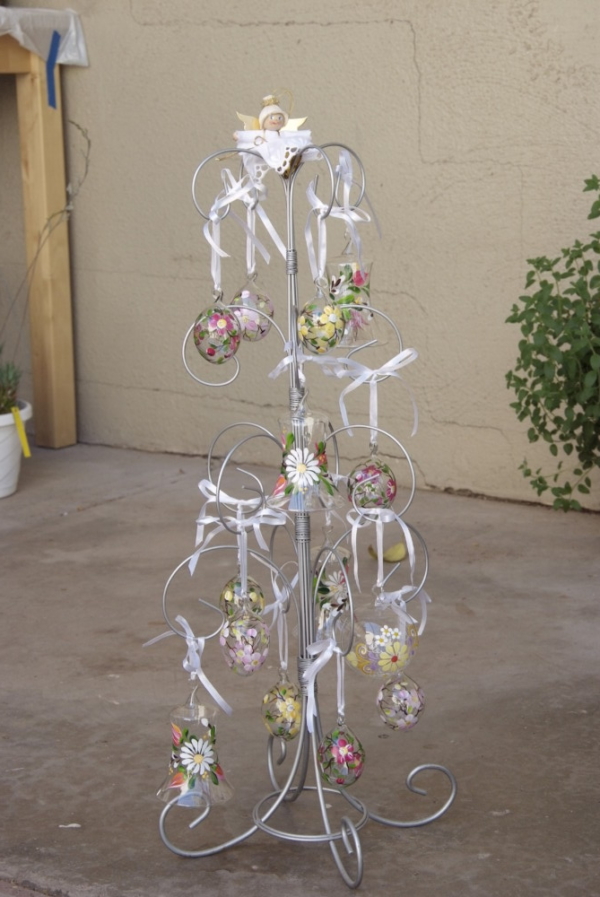 Aluminum tree stand decorated with crystal balls and bells