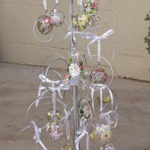 Aluminum tree stand decorated with crystal balls and bells