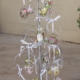 Aluminum tree stand decorated with crystal balls and bells