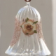 A long Egyptian Glass Crystal bell with lace band