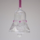 A crystal bell with white fancy lace and pink beads