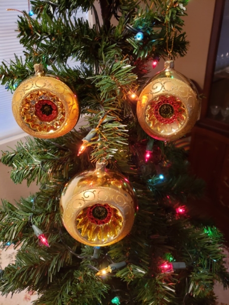 Gold color Glass balls hanging on the Christmas tree