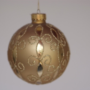 Hand-painted glittery gold designs on gold ball