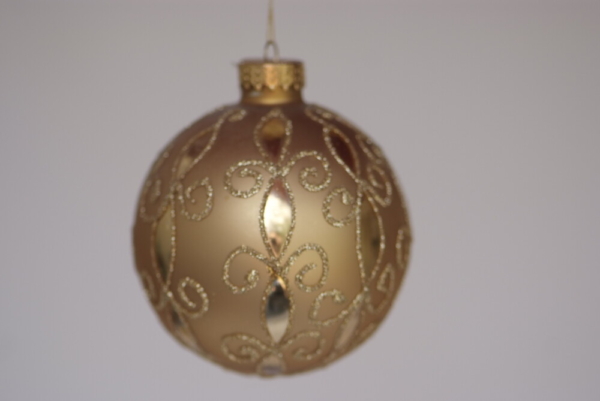 Hand-painted glittery gold designs on gold ball